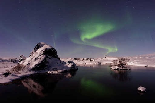 Iceland mountains with northern lights overhead