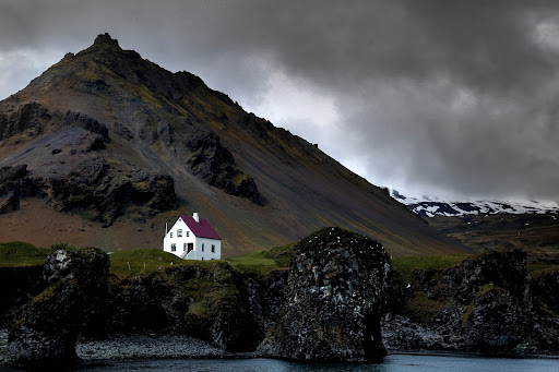 White house on the cliffs in the Westfjord region of Iceland