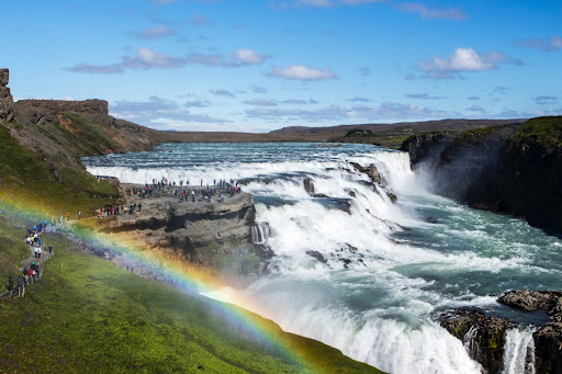 Rainbow over Gullfoss waterfall in Iceland on a sunny day