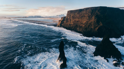 Dramatic view of Iceland cliffs overlooking rough seas